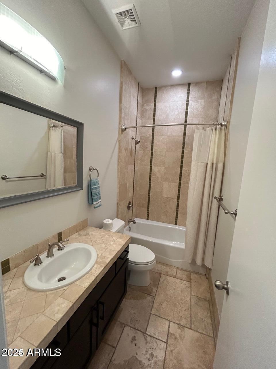 3552 East Jaeger Circle Mesa, AZ 85213 - Photo 16 of 21 a bathroom with a sink a toilet and a mirror