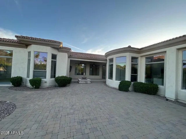 a view of a house with backyard and porch