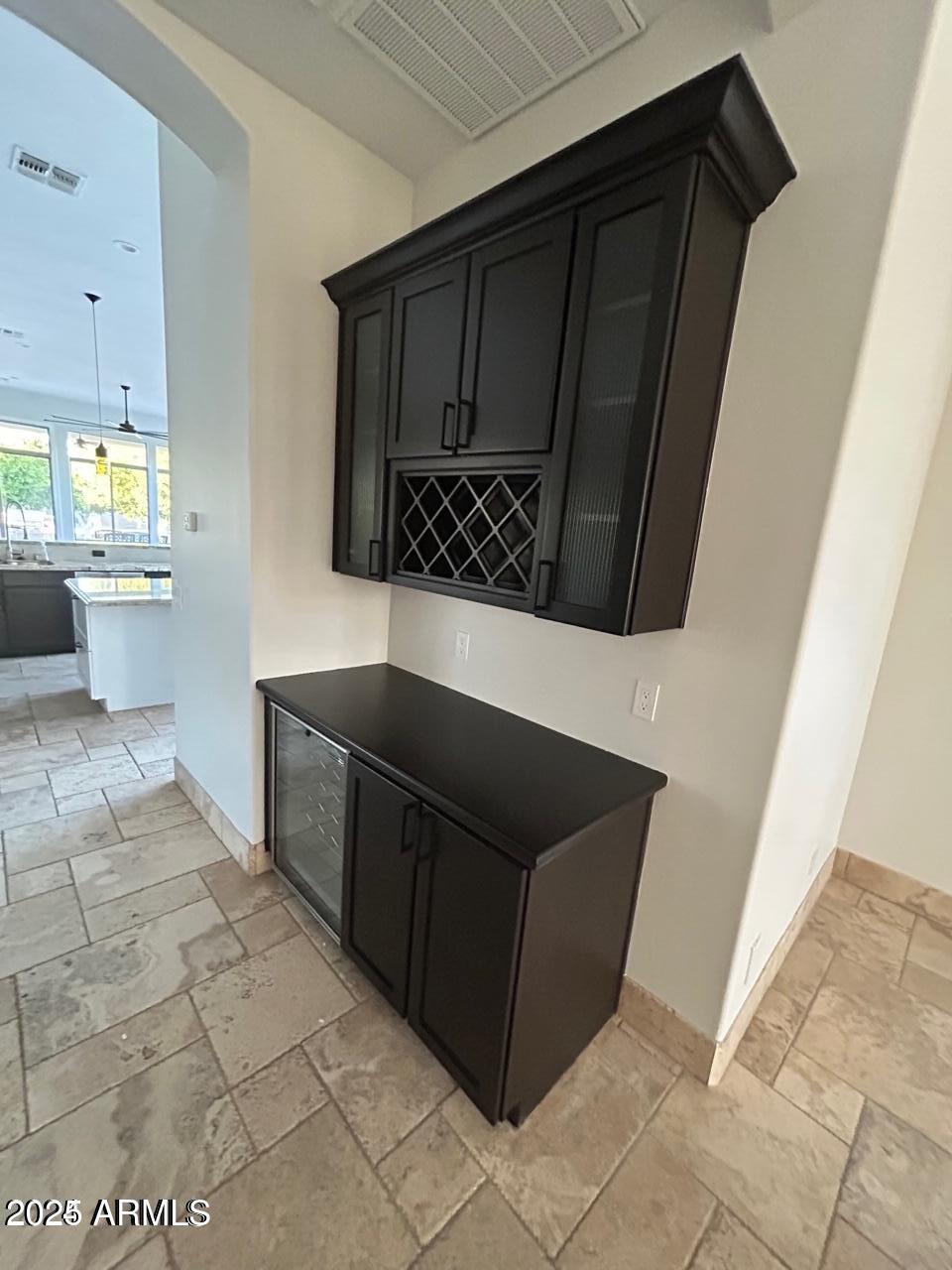 3552 East Jaeger Circle Mesa, AZ 85213 - Photo 4 of 21 a view of a refrigerator in kitchen and wooden floor