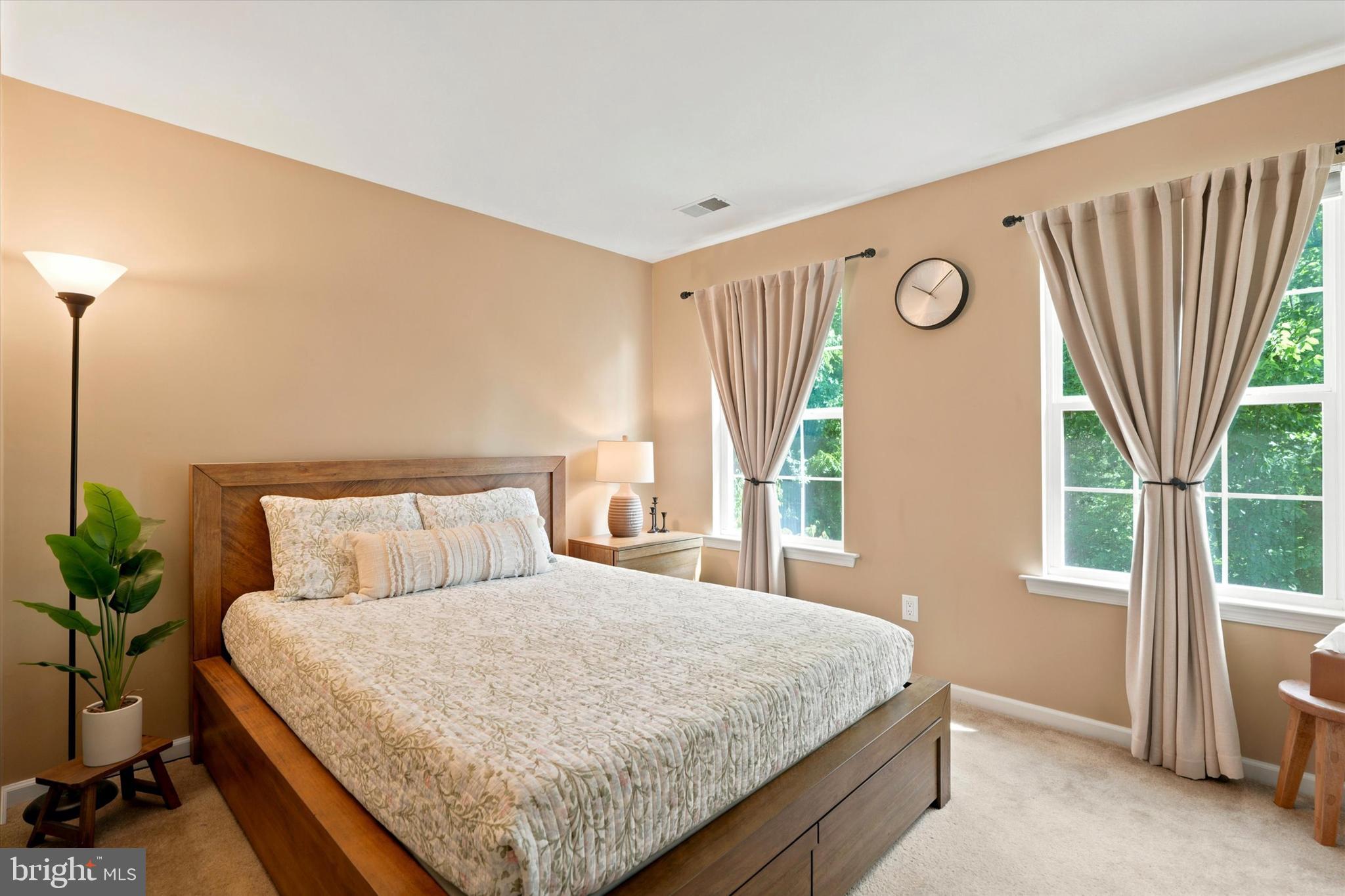 215 Flagstone Road, Unit 1 Chester Springs, PA 19425 - Photo 17 of 33 a bedroom with a large bed and a large window