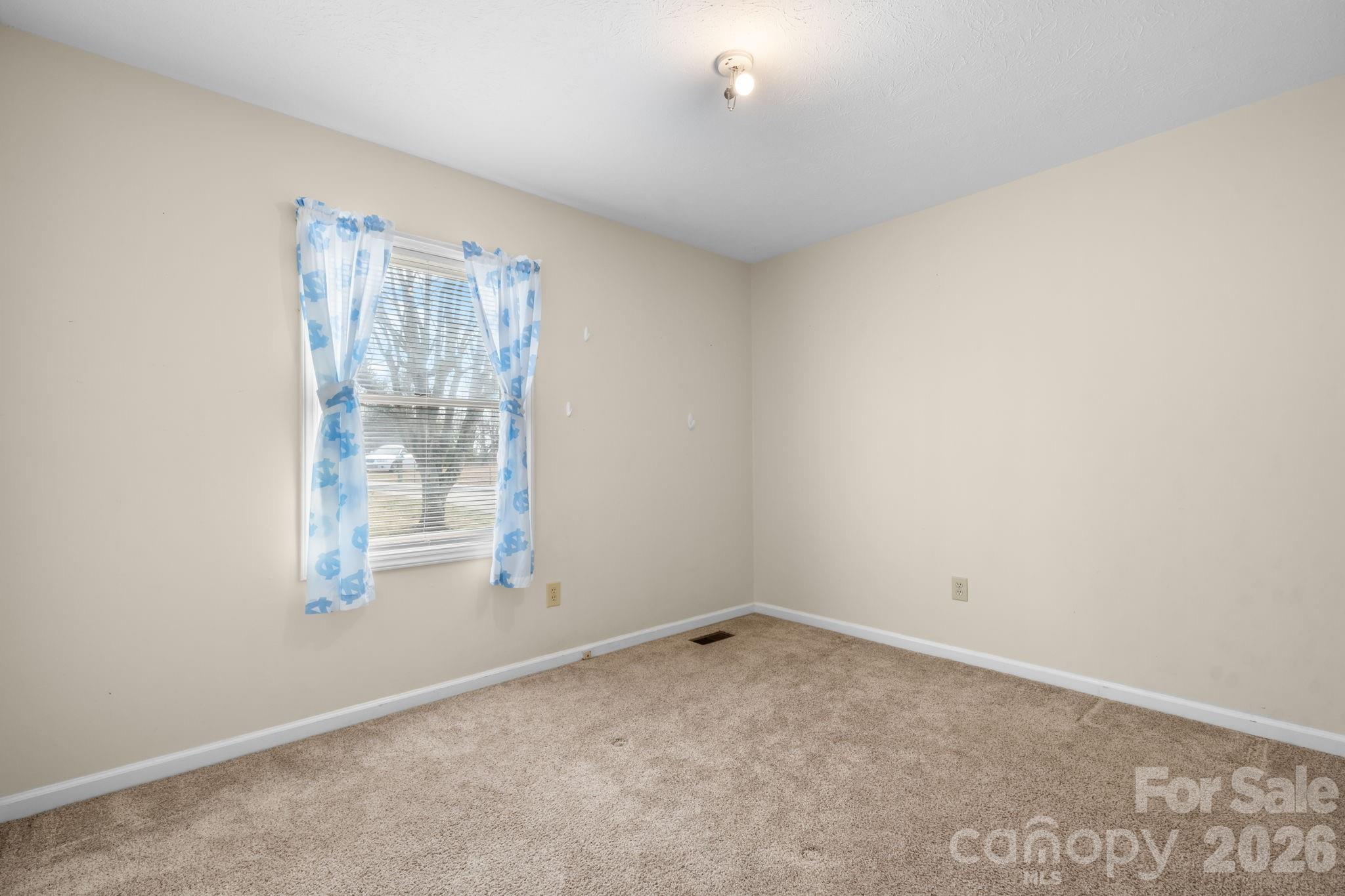 3384 Sheely Road Lenoir, NC 28645 - Photo 19 of 27 an empty room with windows