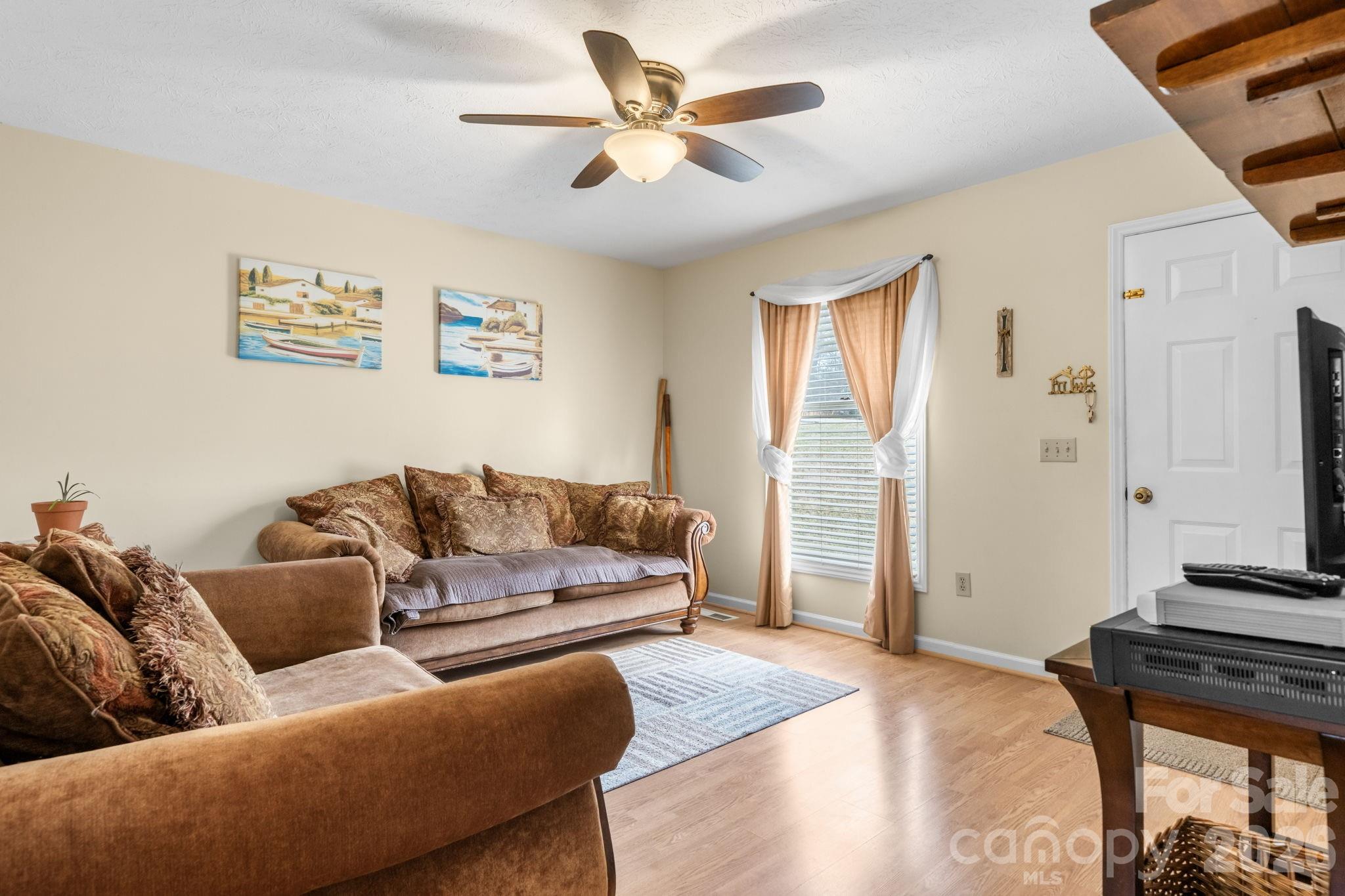 3384 Sheely Road Lenoir, NC 28645 - Photo 20 of 27 a living room with furniture and a flat screen tv