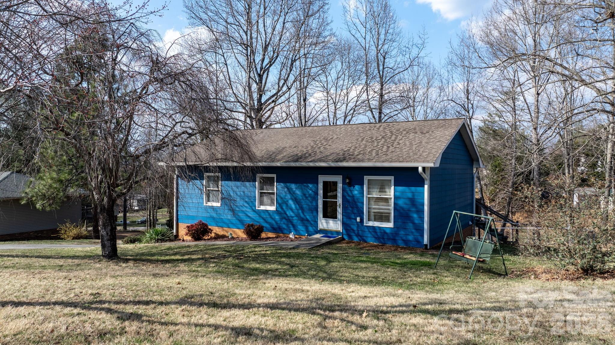 3384 Sheely Road Lenoir, NC 28645 - Photo 2 of 27 a view of a house with a yard and large tree