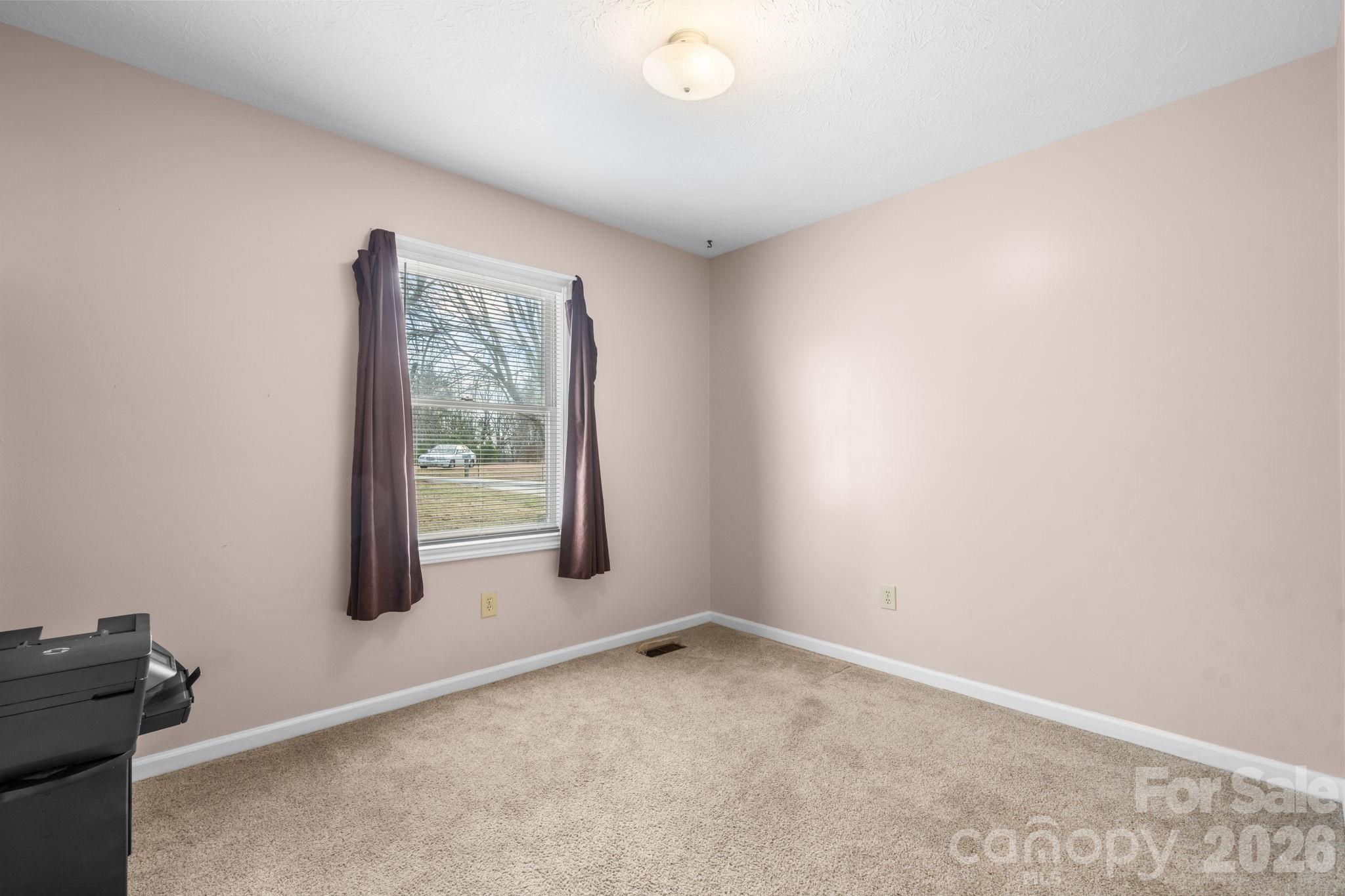 3384 Sheely Road Lenoir, NC 28645 - Photo 22 of 27 an empty room with windows