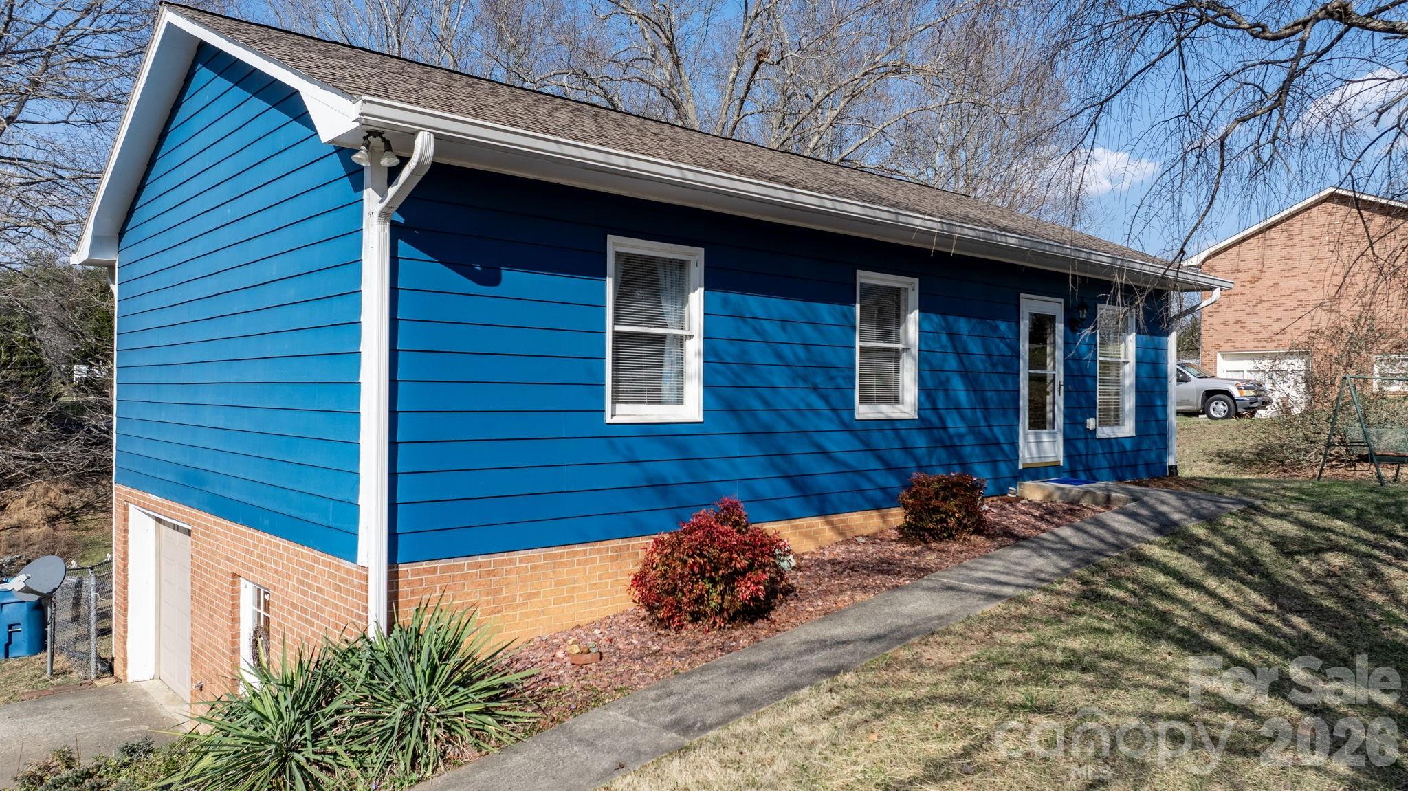 3384 Sheely Road Lenoir, NC 28645 - Photo 4 of 27 a view of a house with a yard