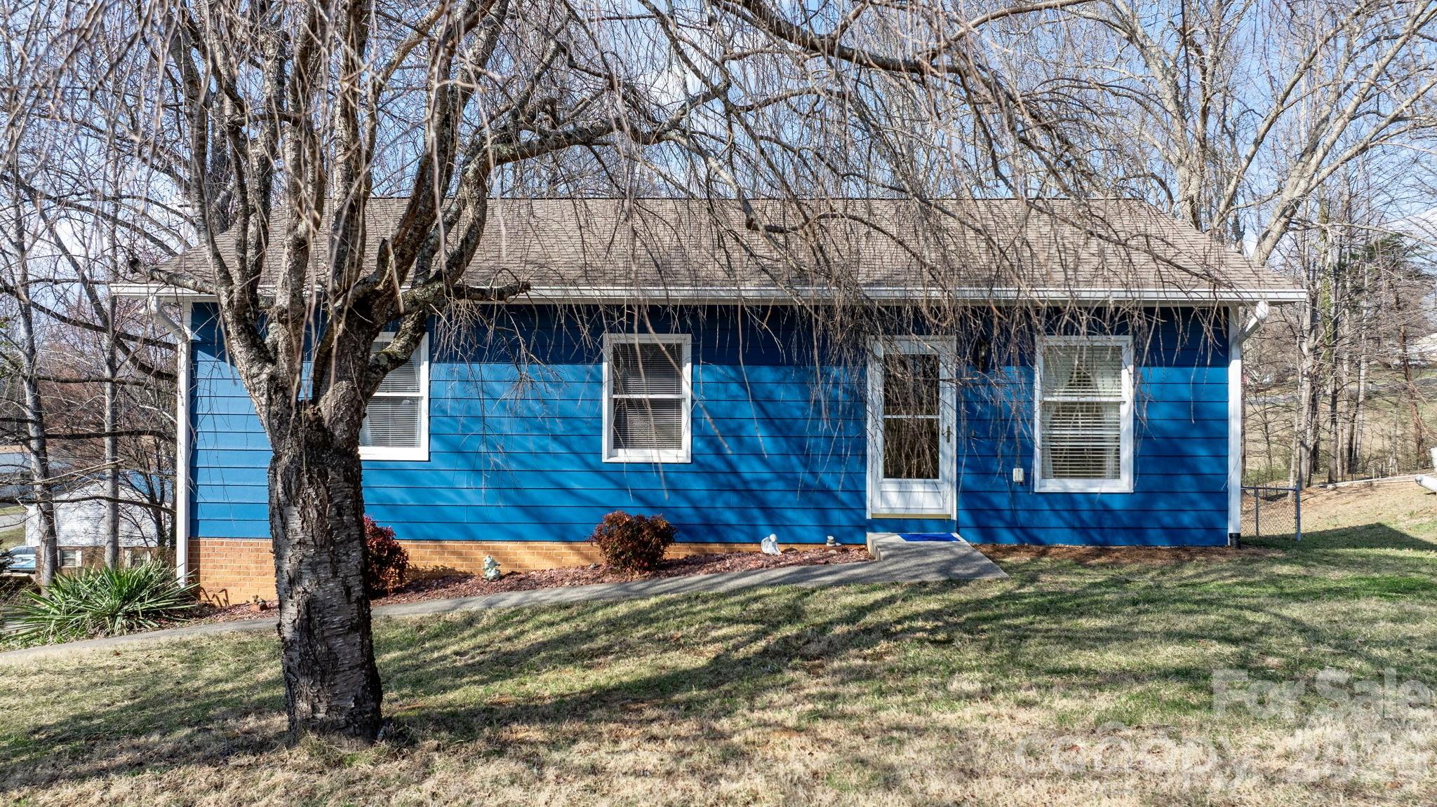 3384 Sheely Road Lenoir, NC 28645 - Photo 6 of 27 a front view of house with yard