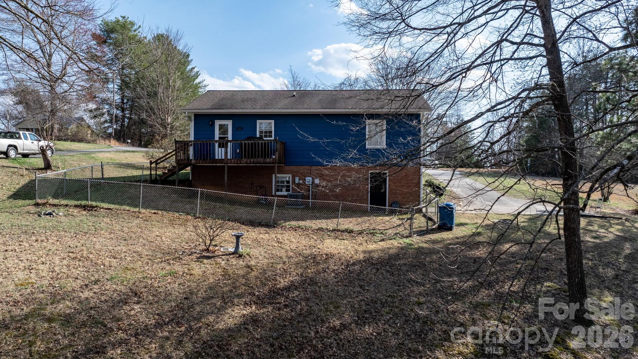 3384 Sheely Road Lenoir, NC 28645 - Photo 7 of 27 a view of a house with a yard and tree