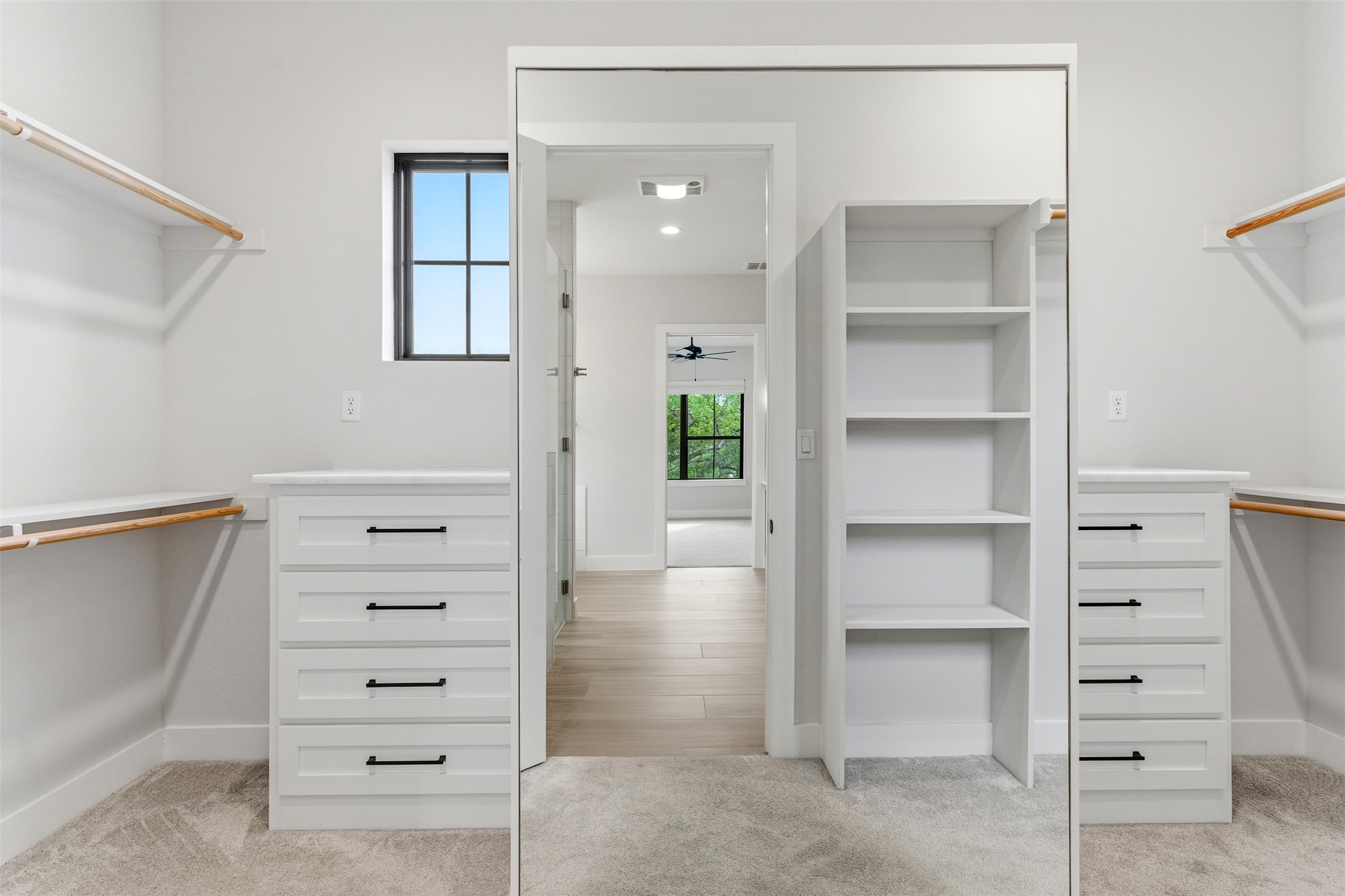 27619 Sunset Loop Garden Ridge, TX 78266 - Photo 14 of 39 Ample built-in storage and custom shelving define this well-appointed wardrobe space.