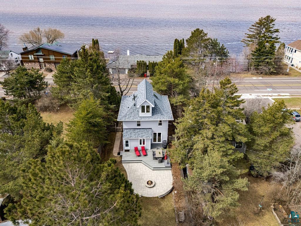 3206 Minnesota Avenue Duluth, MN 55802 - Photo 2 of 51 Waterfront property featuring a multi-level new (2024) gray-shingled roof and light gray siding