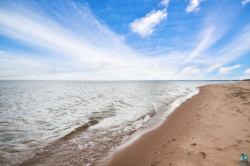 3206 Minnesota Avenue Duluth, MN 55802 - Photo 37 of 51 Expansive sandy beach with calm waters under a broad sky - your own private beach