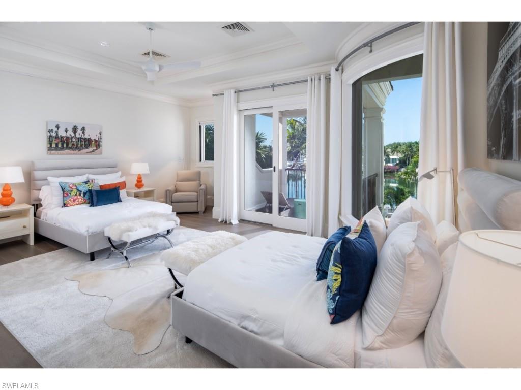 3430 Gin Lane Naples, FL 34102 - Photo 11 of 21 a bedroom with furniture and a large window