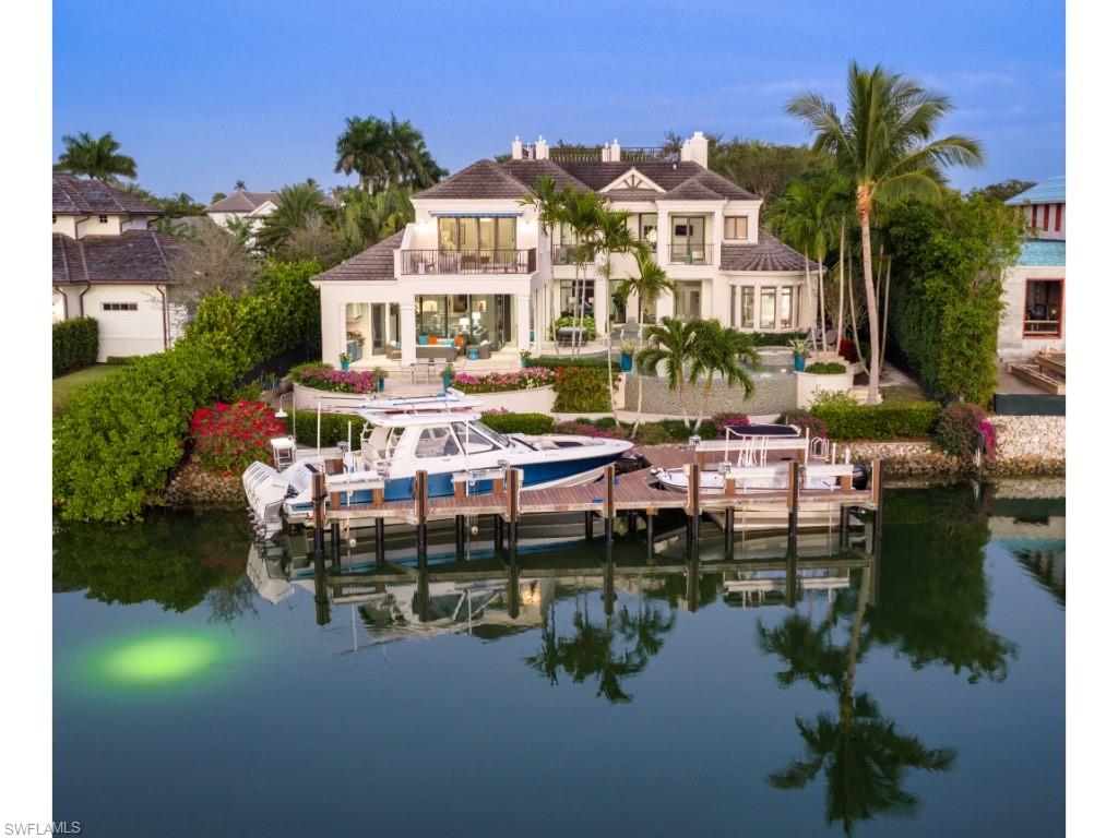 3430 Gin Lane Naples, FL 34102 - Photo 21 of 21 a aerial view of a house with lake view and a garden