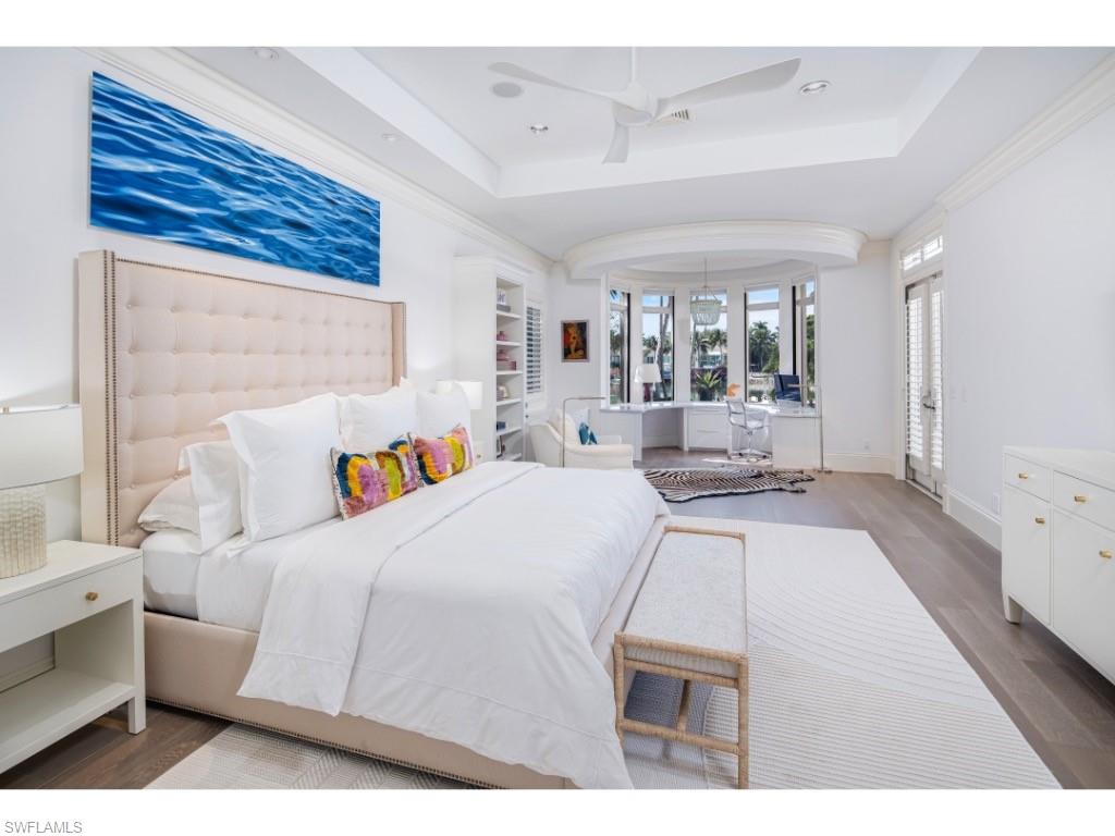 3430 Gin Lane Naples, FL 34102 - Photo 10 of 21 a large white bed in a white room