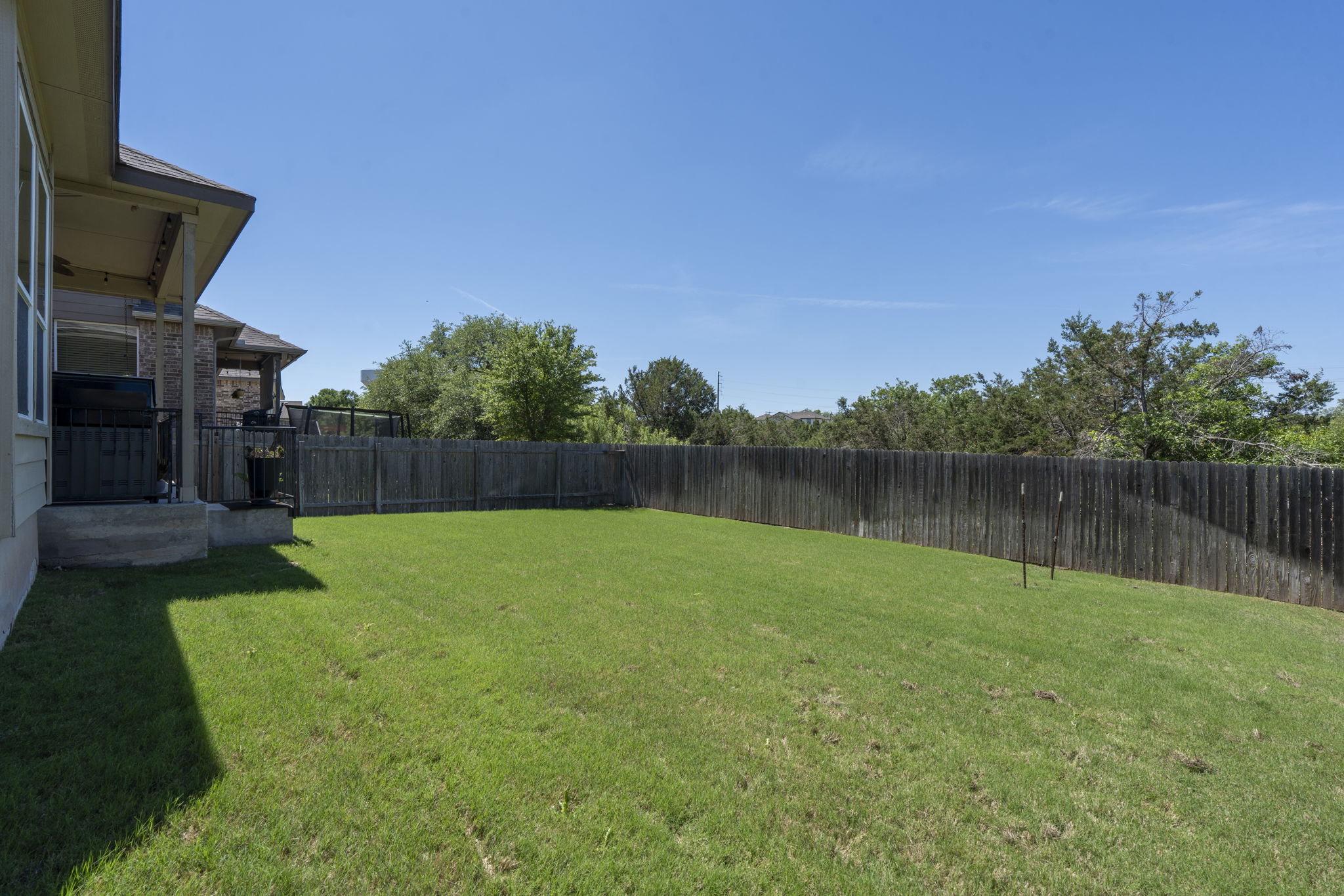 11412 Reading Way Austin, TX 78717 - Photo 30 of 35 a backyard of a house with lots of green space