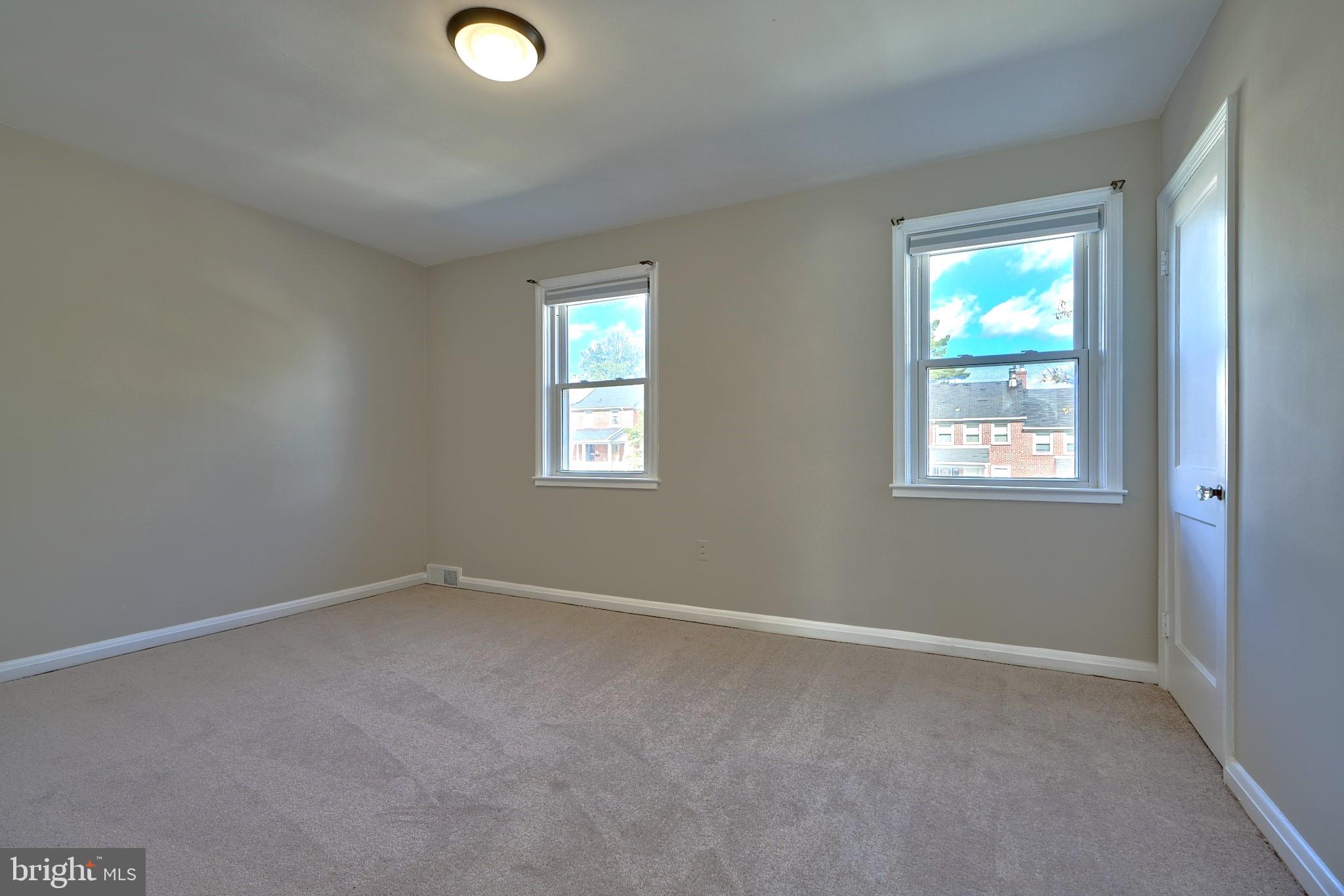 1433 Cedarcroft Road Baltimore, MD 21239 - Photo 18 of 30 an empty room with windows and closet