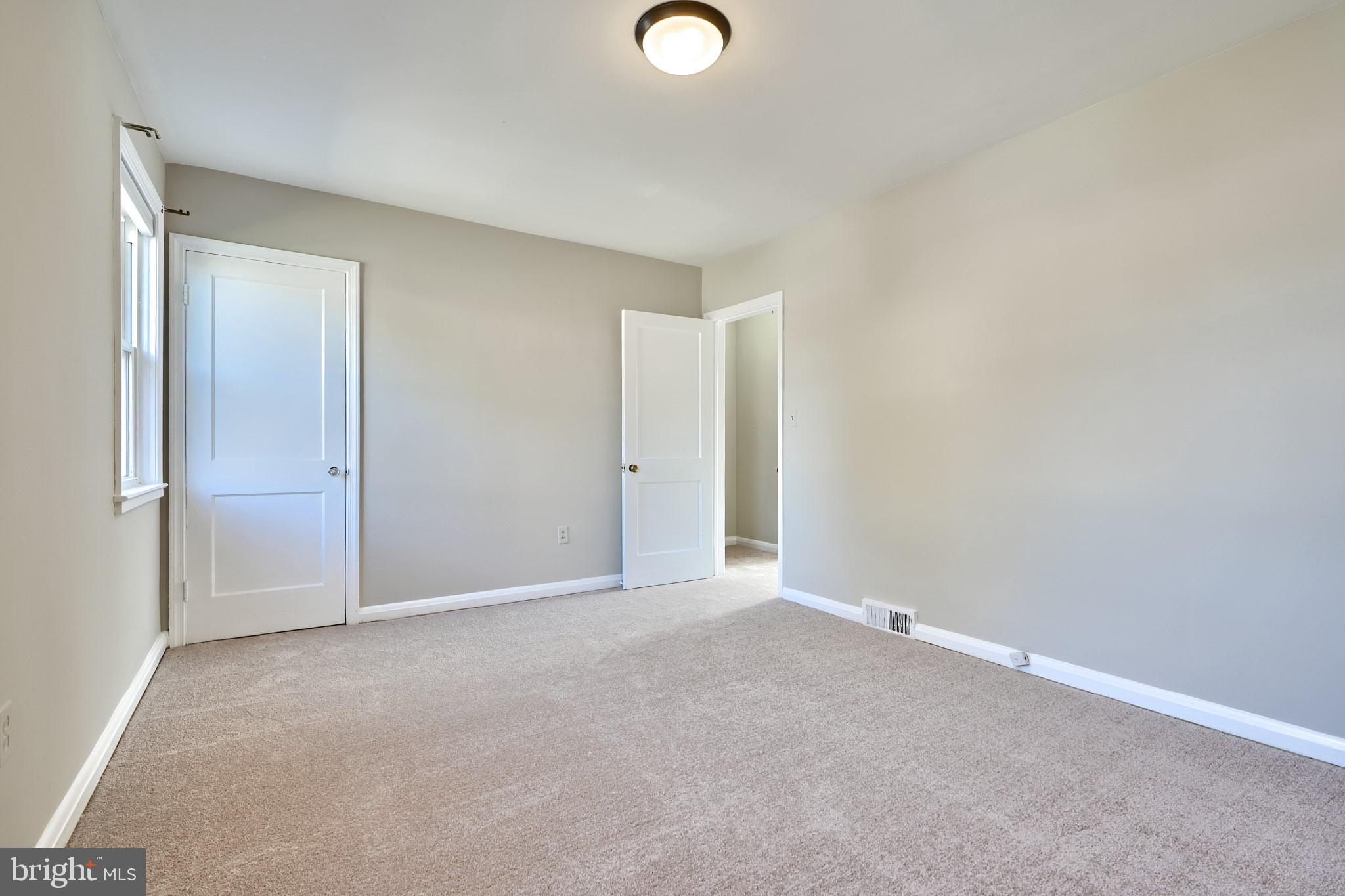1433 Cedarcroft Road Baltimore, MD 21239 - Photo 20 of 30 a view of an empty room and window