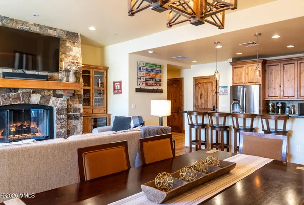 a living room with furniture fireplace and flat screen tv