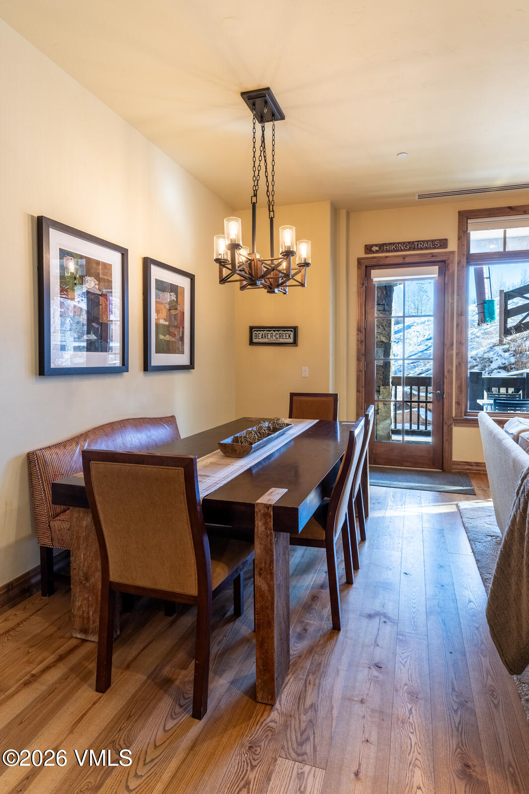 300 Prater Road, Unit B103 Avon, CO 81620 - Photo 13 of 17 a view of a dining room with furniture wooden floor and chandelier
