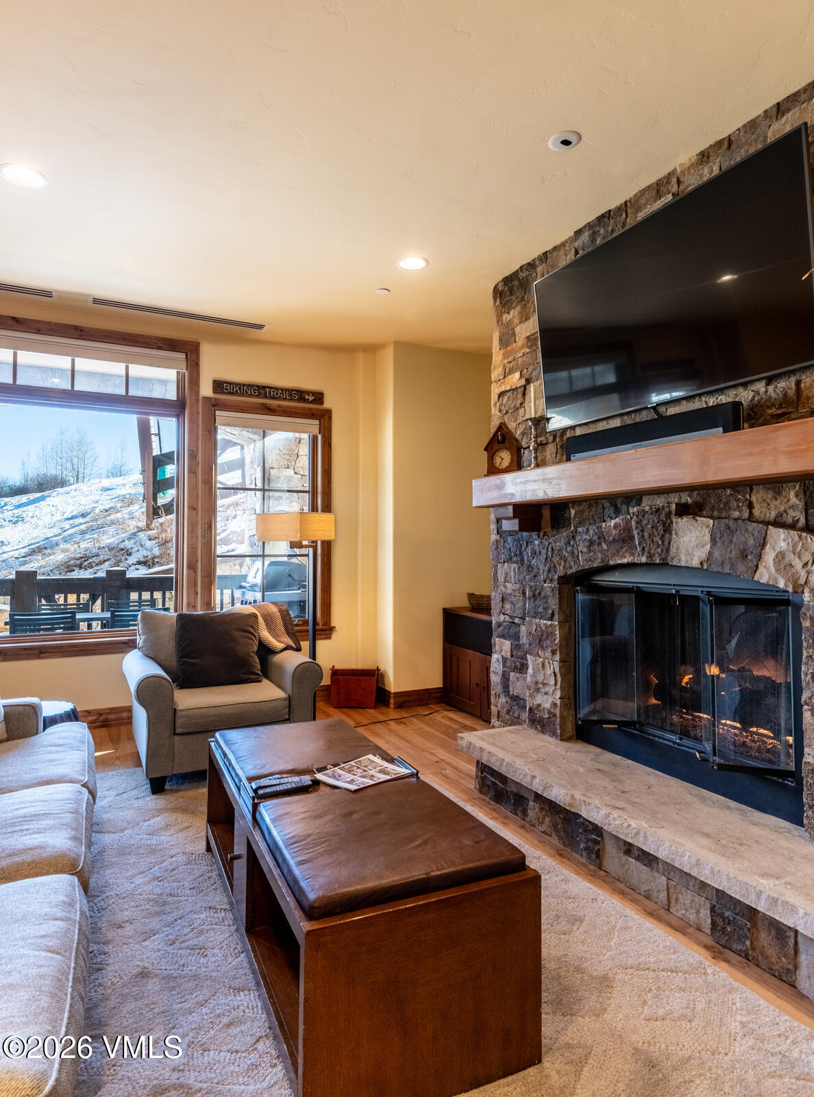 300 Prater Road, Unit B103 Avon, CO 81620 - Photo 14 of 17 a living room with furniture and a fireplace