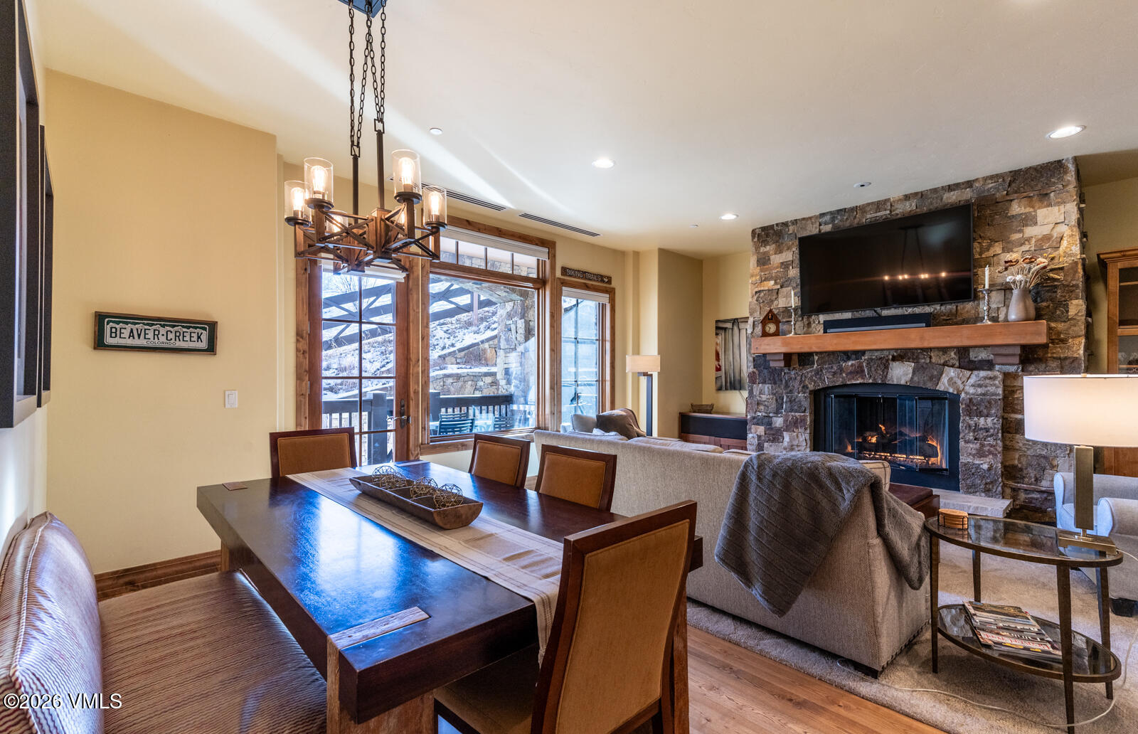 300 Prater Road, Unit B103 Avon, CO 81620 - Photo 4 of 17 a living room with furniture a flat screen tv and a fireplace