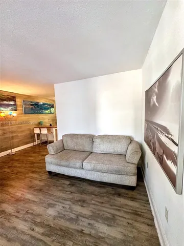 a bathroom with a sink a toilet and shower curtain