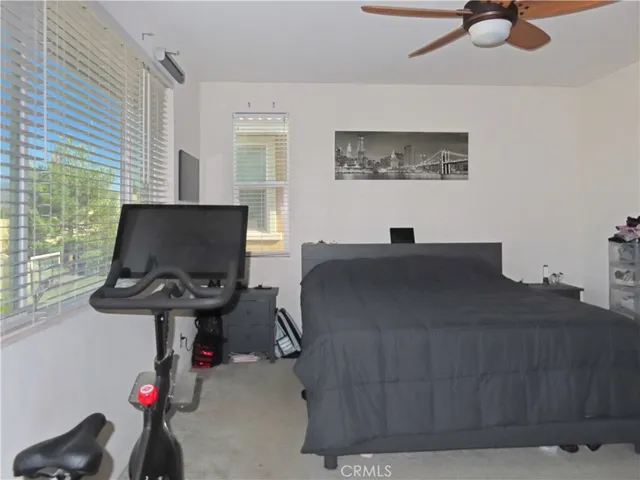 a work room with furniture and a window