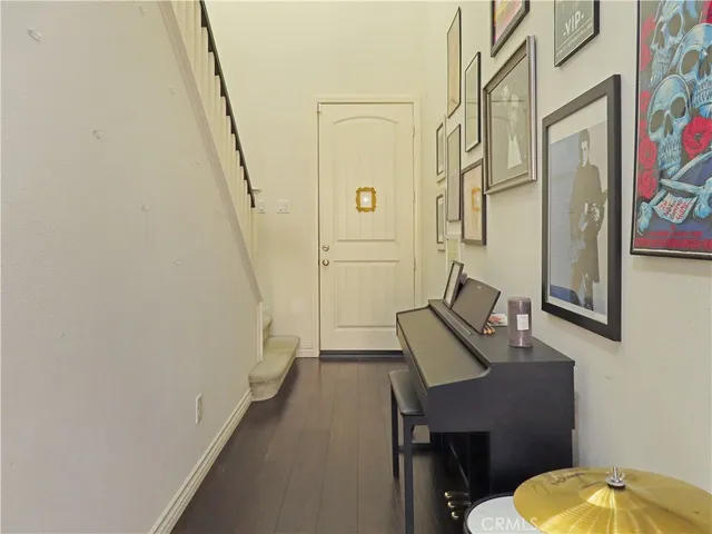 a bathroom with a sink a toilet a mirror and shower