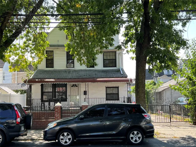 a car parked in front of a house