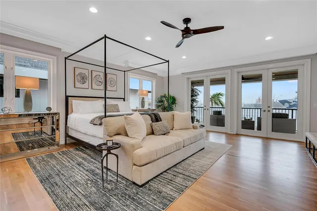 a living room with furniture and a ceiling fan