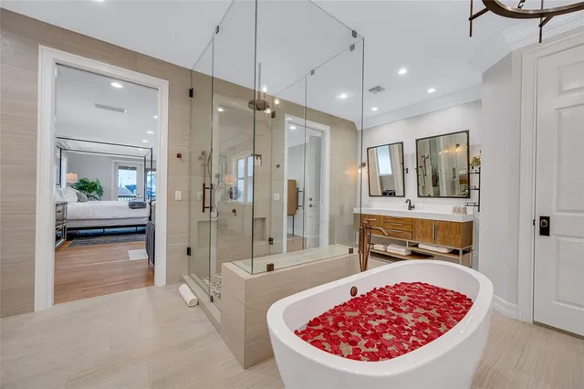 a bathroom with a tub and shower