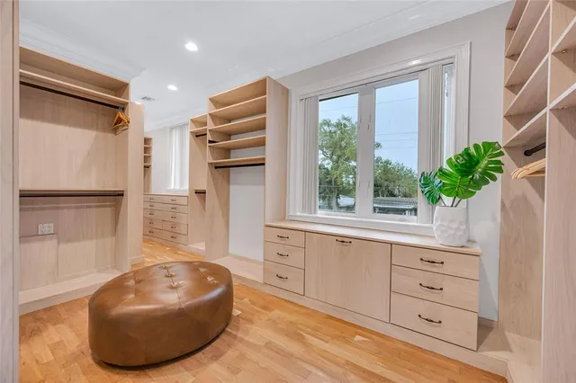 a view of a walk in closet and bathroom