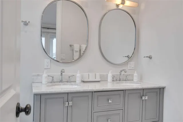 a view of a room with lots of furniture and windows