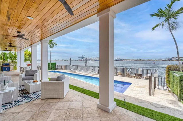 a view of a balcony with two chairs and a table