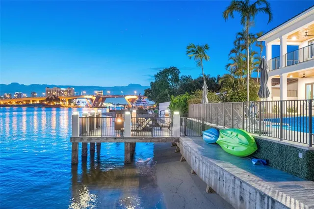a balcony with table and chairs