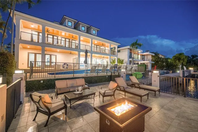 a view of a patio with swimming pool table and chairs