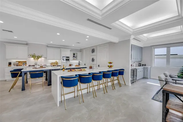 a room with lots of furniture and a dining table