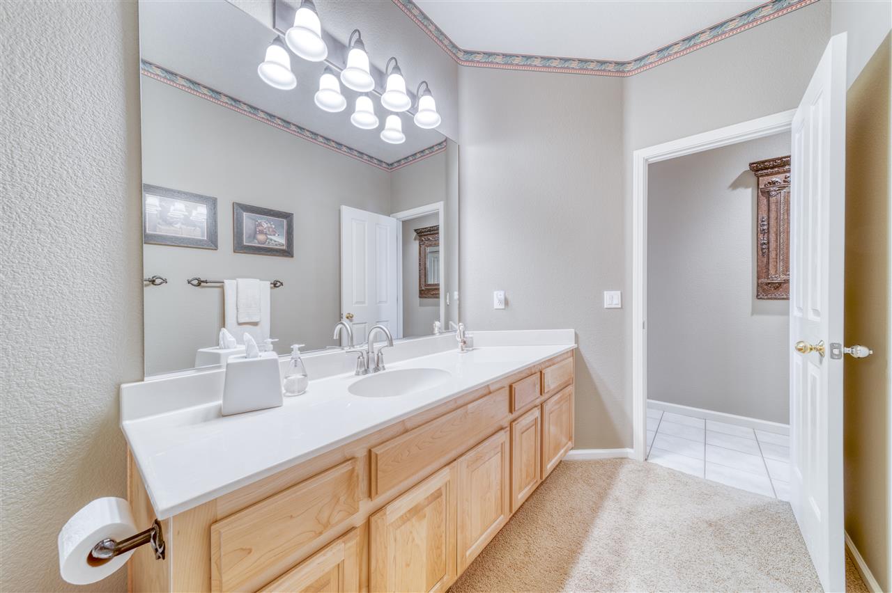 93 Bridle Path Clio, CA 96106 - Photo 15 of 21 a bathroom with a sink a vanity and a mirror