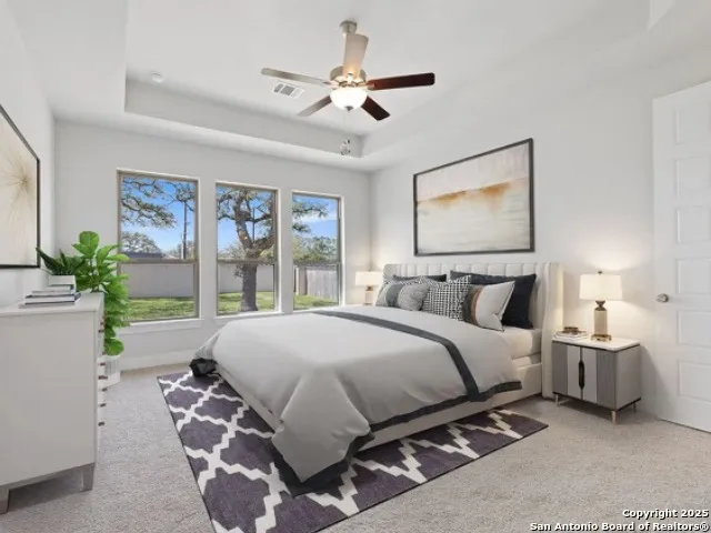 a bed room with a bed and a chandelier