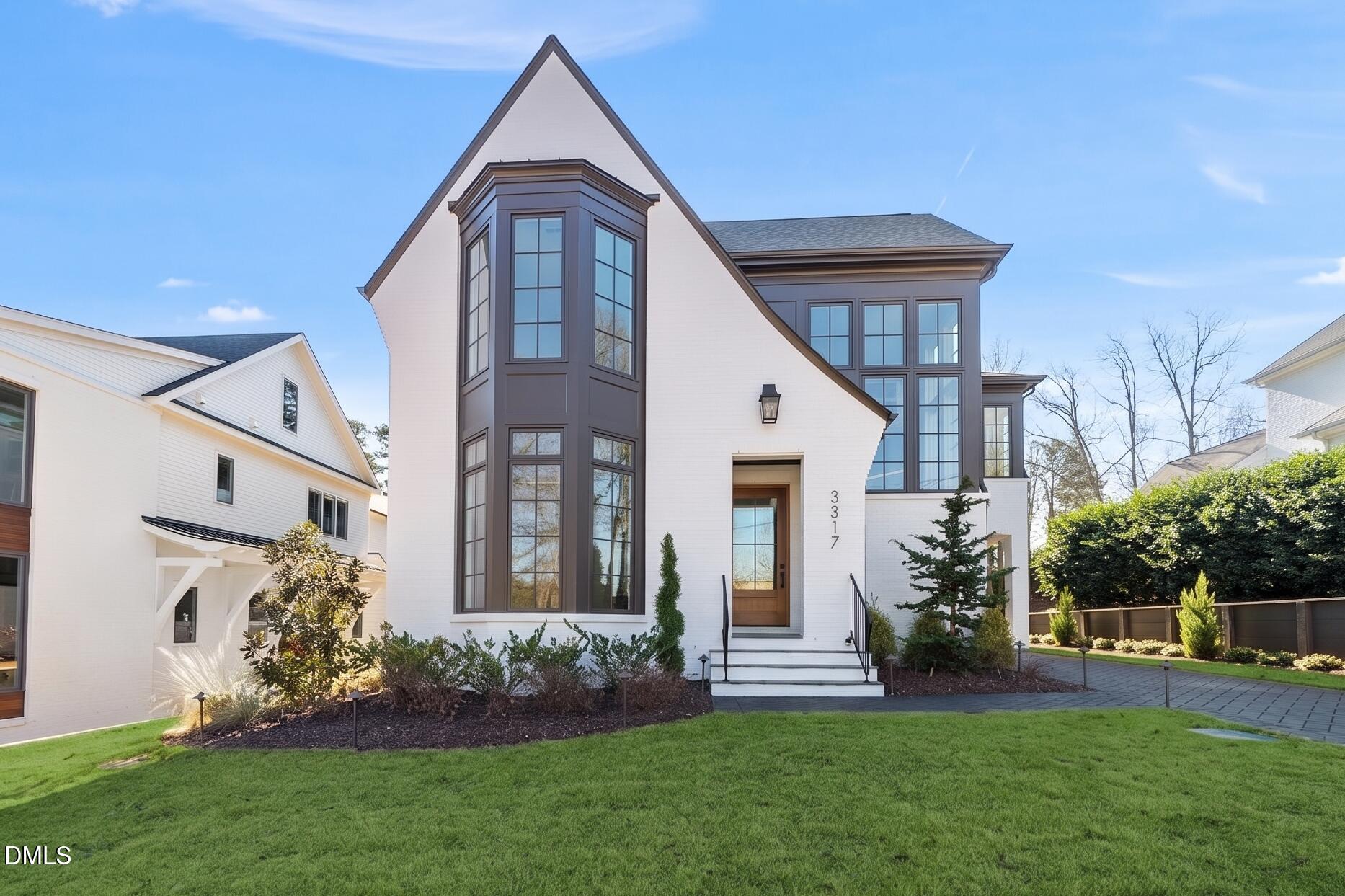 3317 Hampton Road Raleigh, NC 27607 - Photo 2 of 45 a front view of a house with a garden