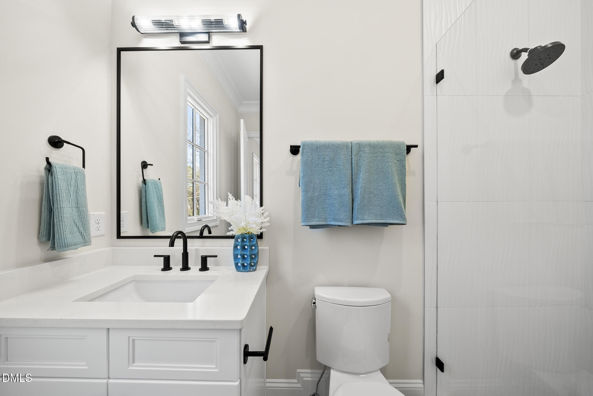 3317 Hampton Road Raleigh, NC 27607 - Photo 21 of 45 a bathroom with a sink vanity mirror and toilet