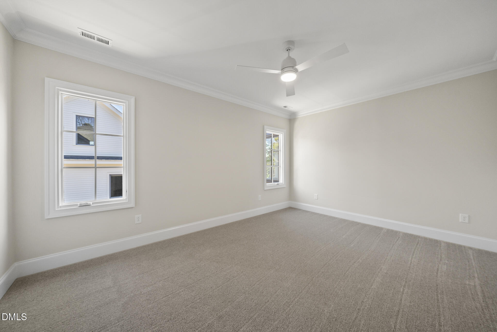3317 Hampton Road Raleigh, NC 27607 - Photo 32 of 45 an empty room with chandelier fan and windows