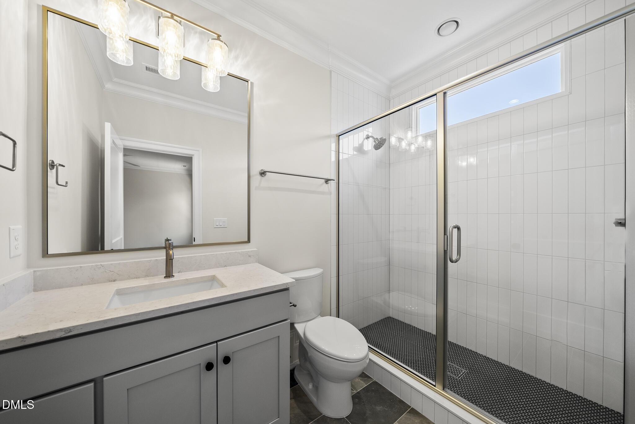 3317 Hampton Road Raleigh, NC 27607 - Photo 33 of 45 a bathroom with a shower sink vanity mirror and toilet