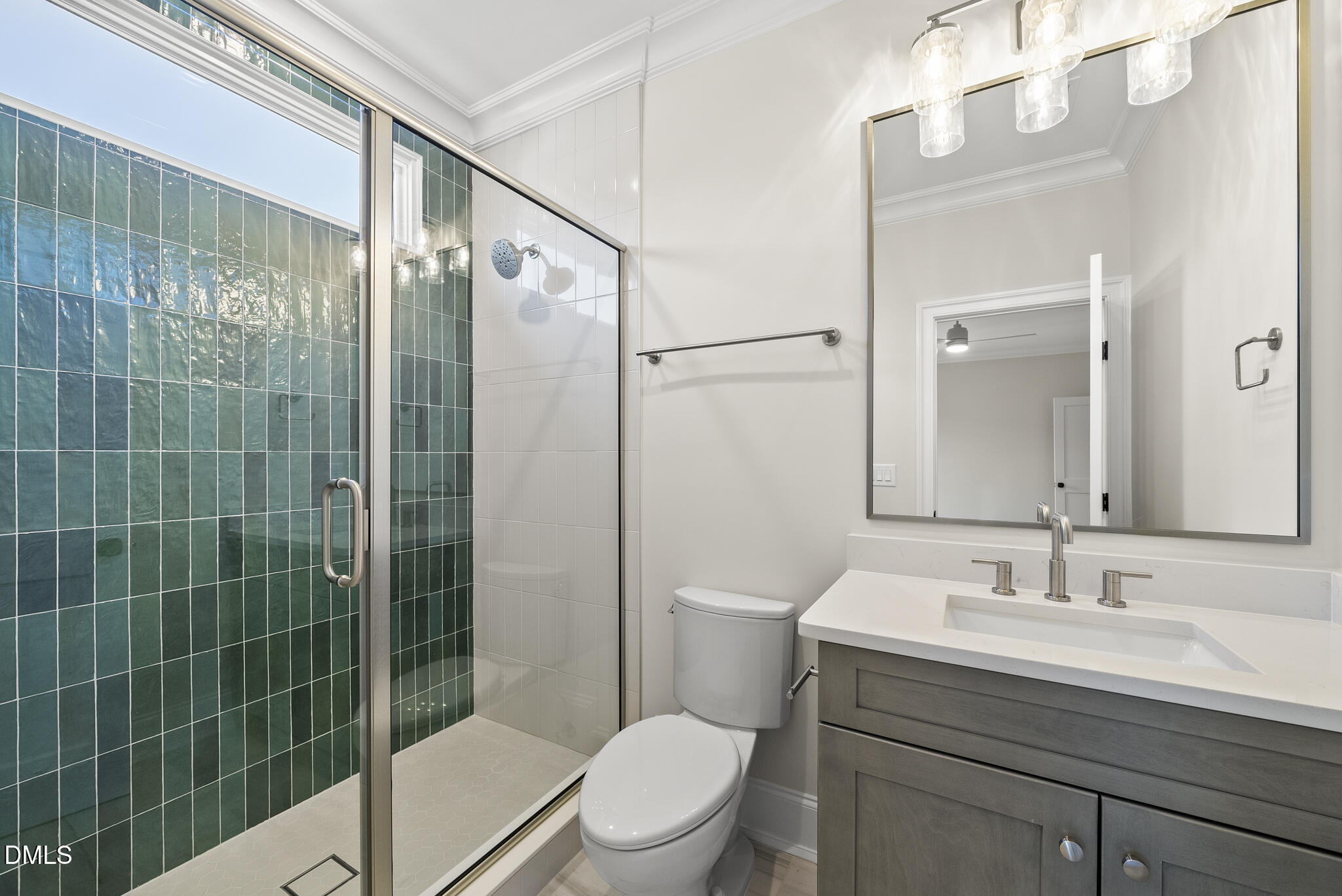 3317 Hampton Road Raleigh, NC 27607 - Photo 35 of 45 a bathroom with a sink a toilet a mirror and shower