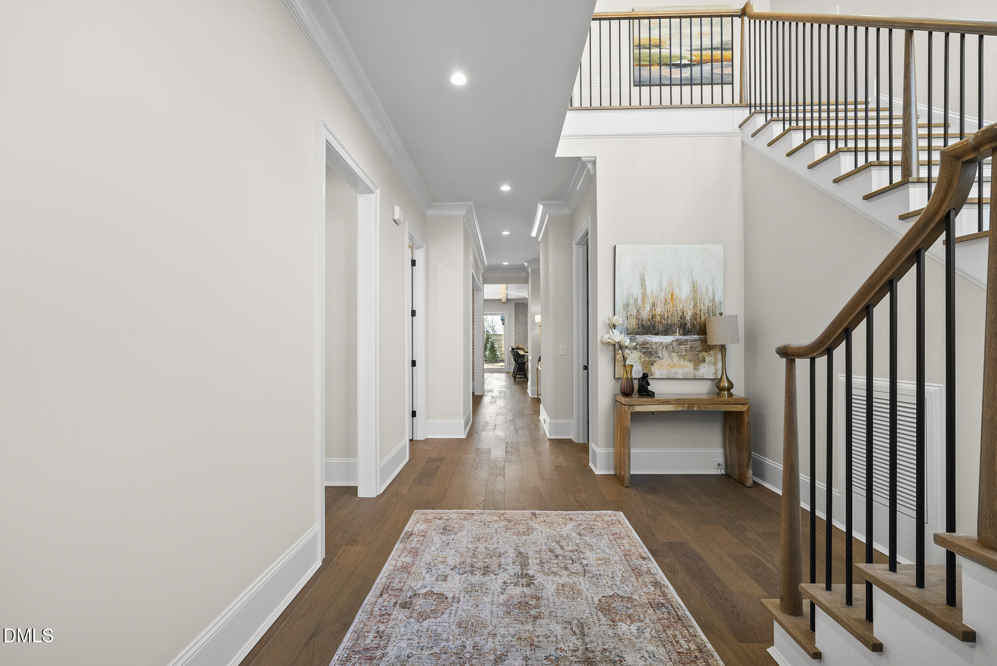 3317 Hampton Road Raleigh, NC 27607 - Photo 5 of 45 a view of a hallway with wooden floor and furniture