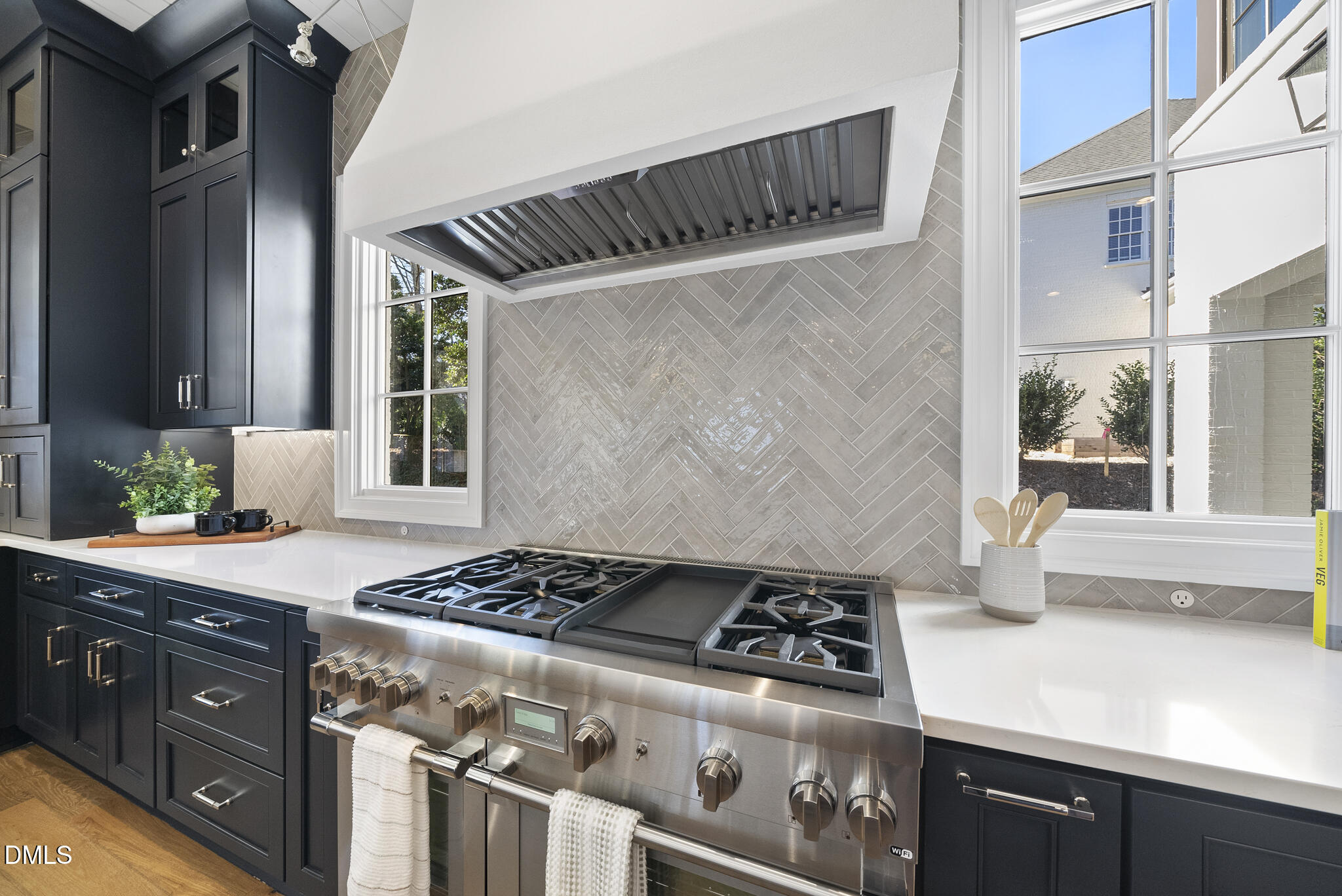 3317 Hampton Road Raleigh, NC 27607 - Photo 10 of 45 a kitchen with granite countertop a stove and a sink