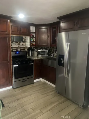 a view of a balcony with furniture