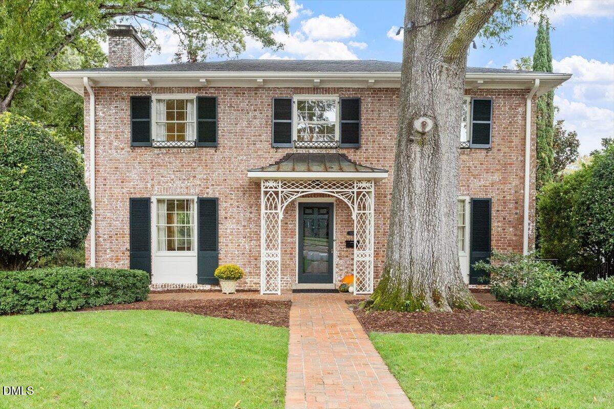 1128 Harvey Street Raleigh, NC 27608 - Photo 1 of 41 a front view of a house with garden