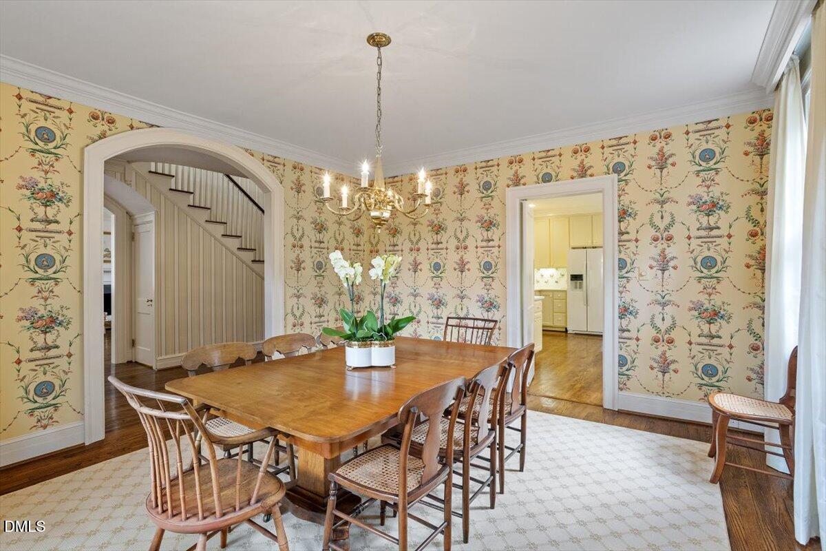 1128 Harvey Street Raleigh, NC 27608 - Photo 13 of 41 a view of a dining room with furniture and chandelier