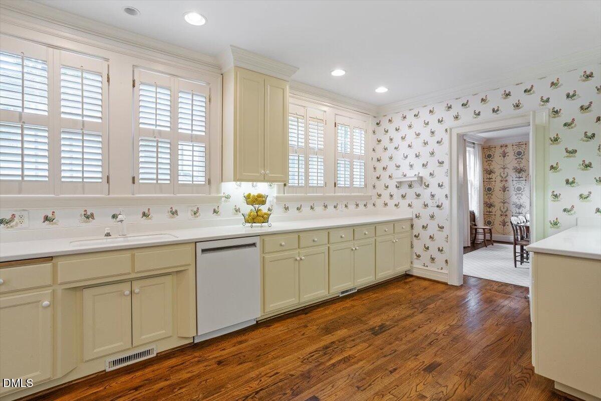 1128 Harvey Street Raleigh, NC 27608 - Photo 14 of 41 a spacious bathroom with double vanity and a large mirror
