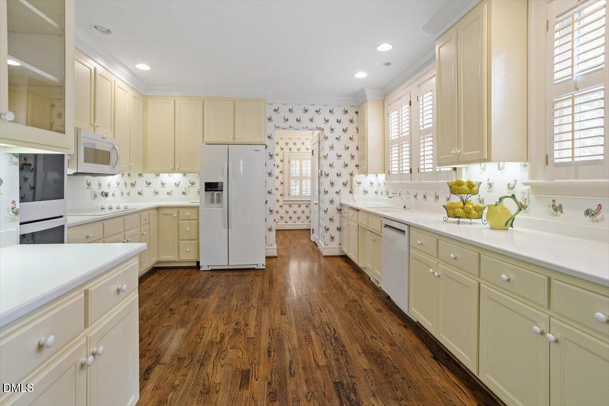 1128 Harvey Street Raleigh, NC 27608 - Photo 16 of 41 a large kitchen with a lot of counter space and wooden floor